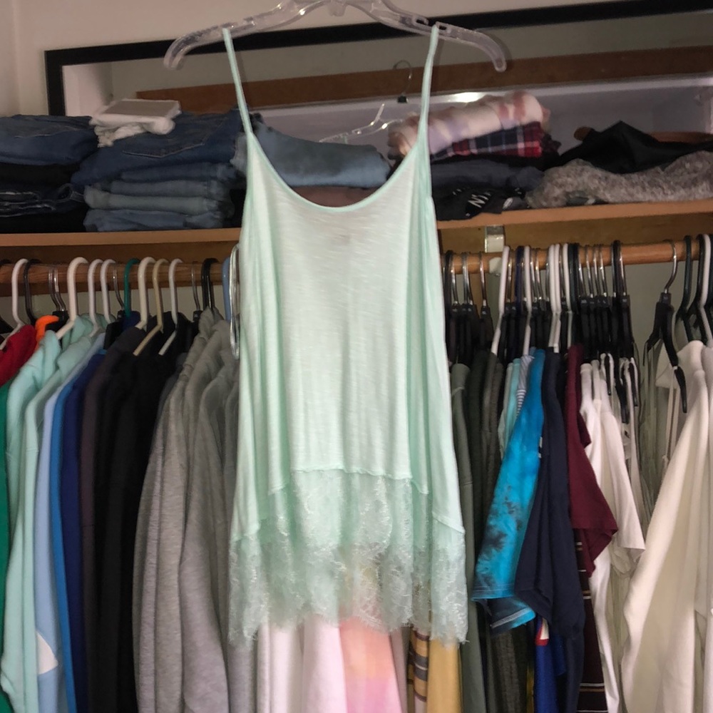 Teal tank top with lace at the bottom